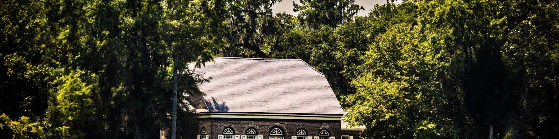 Pompion Hill Chapel is small "back parish" church near Huger, South Carolina. Built in 1763, it is a virtually unaltered example of a brick Georgian parish church, retaining interior and exterior finishes
