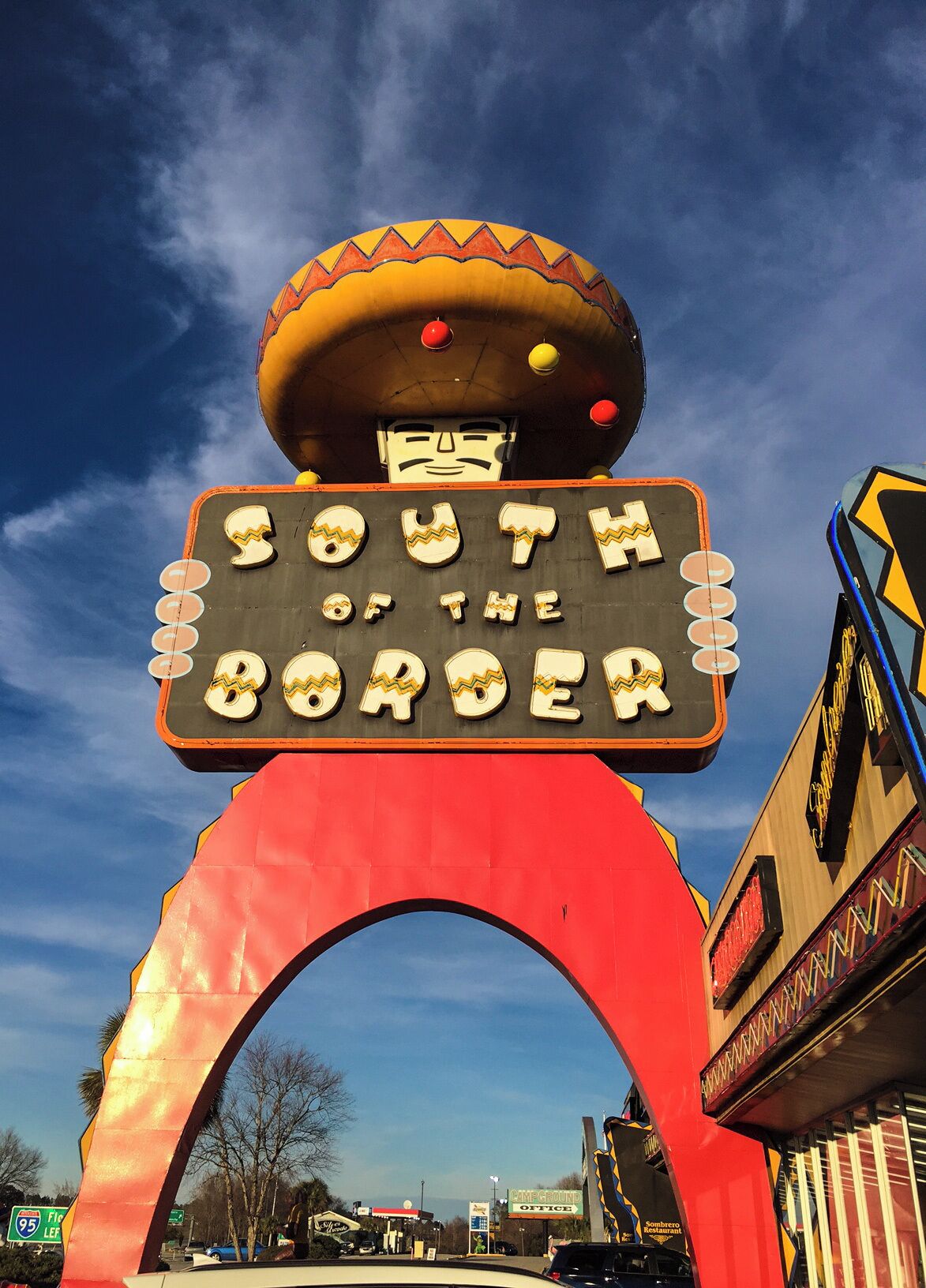 South of the Border is a huge tourist trap south of the North Carolina and South Carolina state borders on Interstate 95-no place near Mexico, but this Mexican-style rest stop has been attracting people since the 1950's.  Billboards advertising this famous truck/rest stop can be seen several states away, each sign with a catchy saying to make you smile and to count the miles till you can hang out with Pedro, the mascot of South of the Border.  
There are several restaurants, gas stations and plenty of shopping for knick-knacks and fireworks.  There is a hotel/motel and a campground-all have use of the huge indoor pool, as well as an outdoor pool.  And if that wasn't enough to do, there is also mini-golf and a reptile exhibit.  The building are sprawled over several blocks, each one painted bright colors and lit well by neon lights at night.   