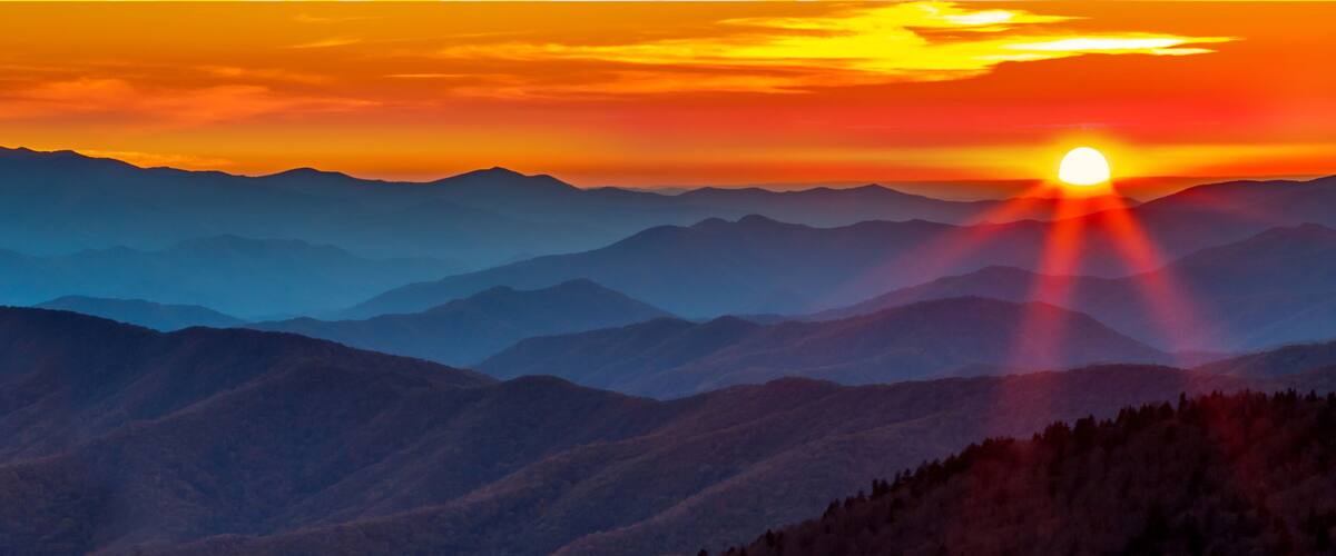 A mountain range with a sunset.