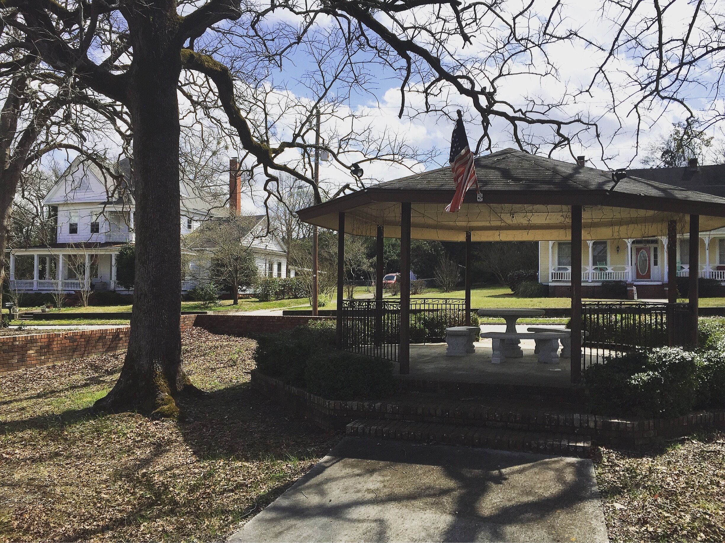 Old town warrenville. Park benches set across from the abandoned factory. 