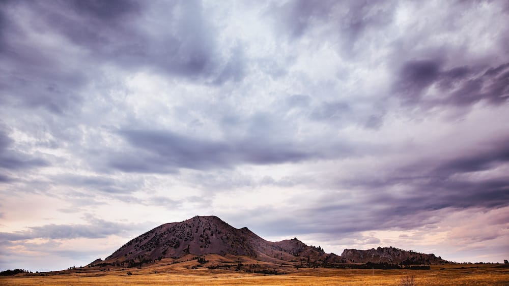 Storm clouds over mountain landscape, Bear Butte State Park, South Dakota, USA