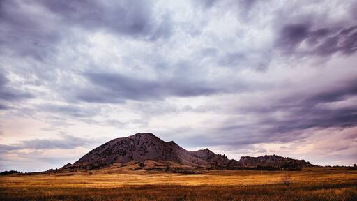 Storm clouds over mountain landscape, Bear Butte State Park, South Dakota, USA