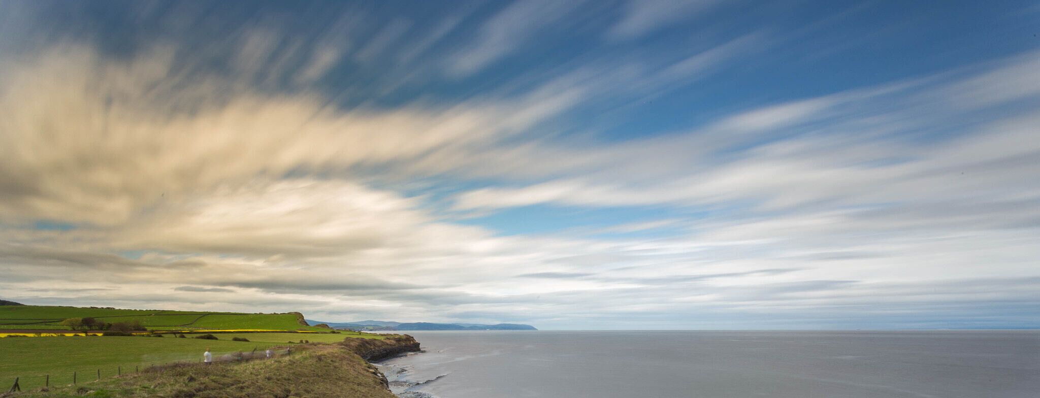500px provided description: Kilve [#sky ,#sea ,#beach ,#clouds ,#cliff ,#beech ,#nd]