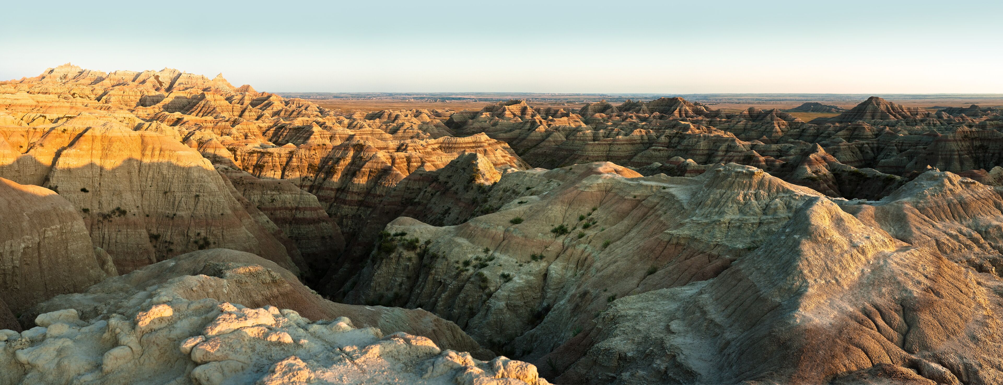 A rugged landscape with layered rock formations and a distant horizon.