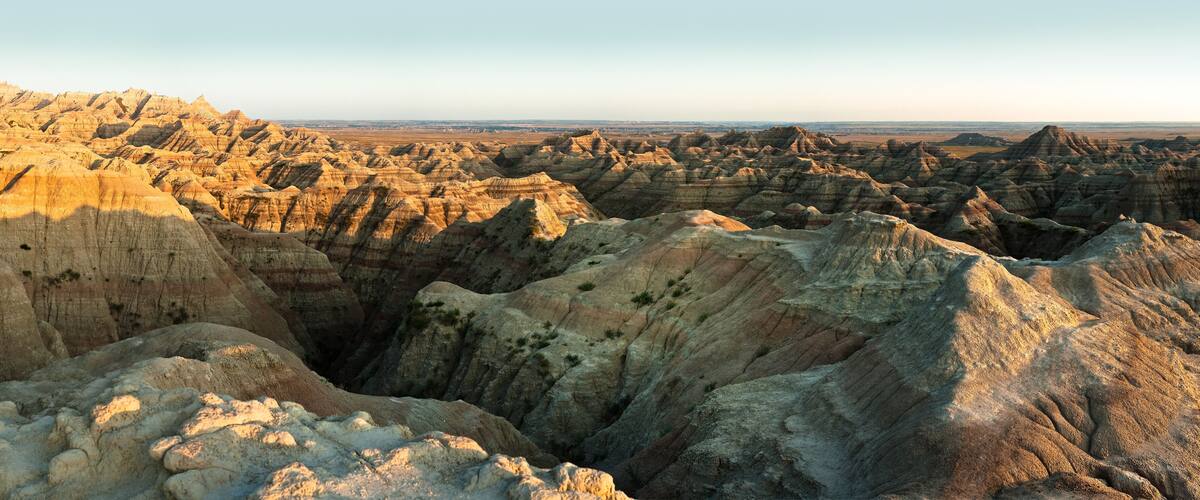 A rugged landscape with layered rock formations and a distant horizon.
