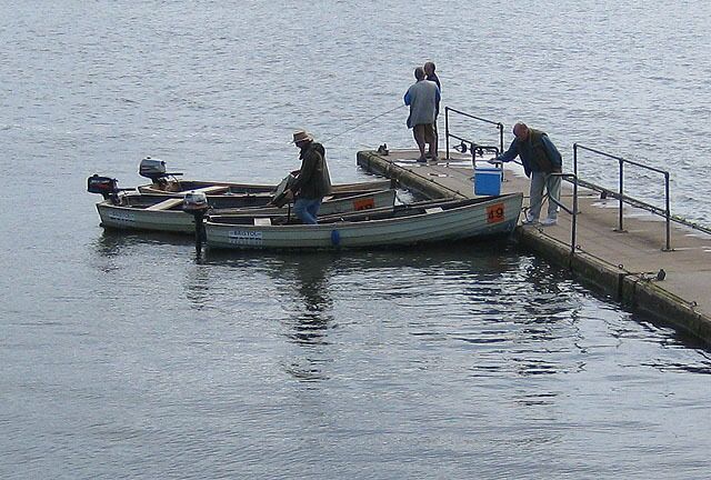 Setting out for an afternoon's fishing A blustery day with intermittent sunshine meant many of the fishermen came back empty handed. At the end of the jetty a fly fishing lesson is in progress on Chew Valley Lake, a reservoir serving the south Bristol area.