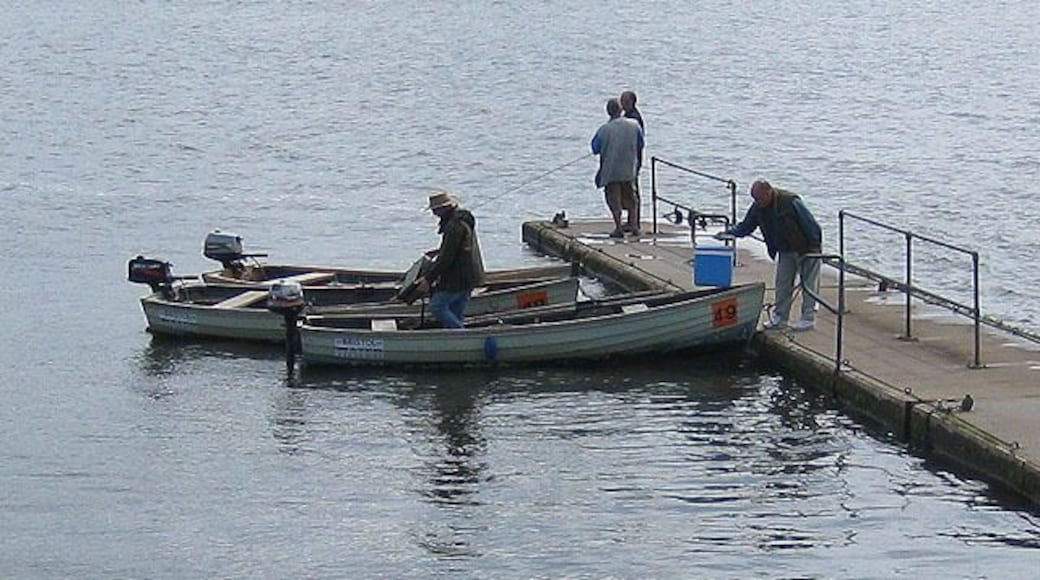 Setting out for an afternoon's fishing A blustery day with intermittent sunshine meant many of the fishermen came back empty handed. At the end of the jetty a fly fishing lesson is in progress on Chew Valley Lake, a reservoir serving the south Bristol area.