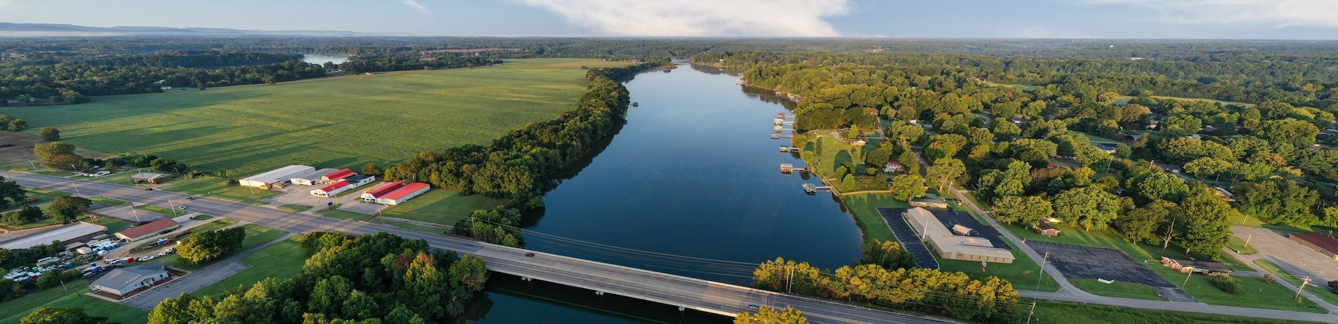 Panorama of a bridge crossing the Elk River. Aerial, overhead, view, of lakefront homes and floating boat docks on Tims Ford Lake in Estill Springs,Tennessee.