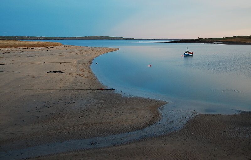 Very Low Tide There isn't usually this much beach here. Taken at sunset on February 12th looking eastwards. The land in the distance is Holm (pronounced "Ham") on Mainland, Orkney.