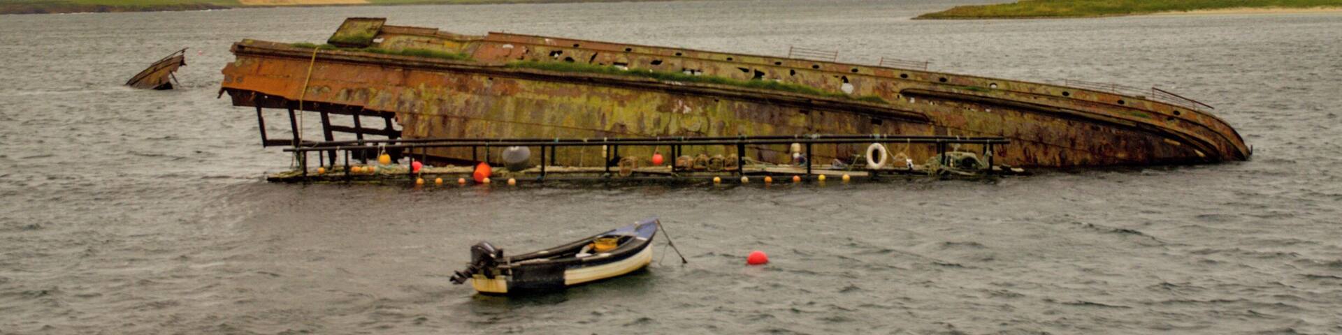 The remains of the German High Seas Fleet that was scuttled in Scapa Flow. View taken from X1 Stagecoach bus crossing the Churchill Barriers from Burray to Mainland (right hand side). #History