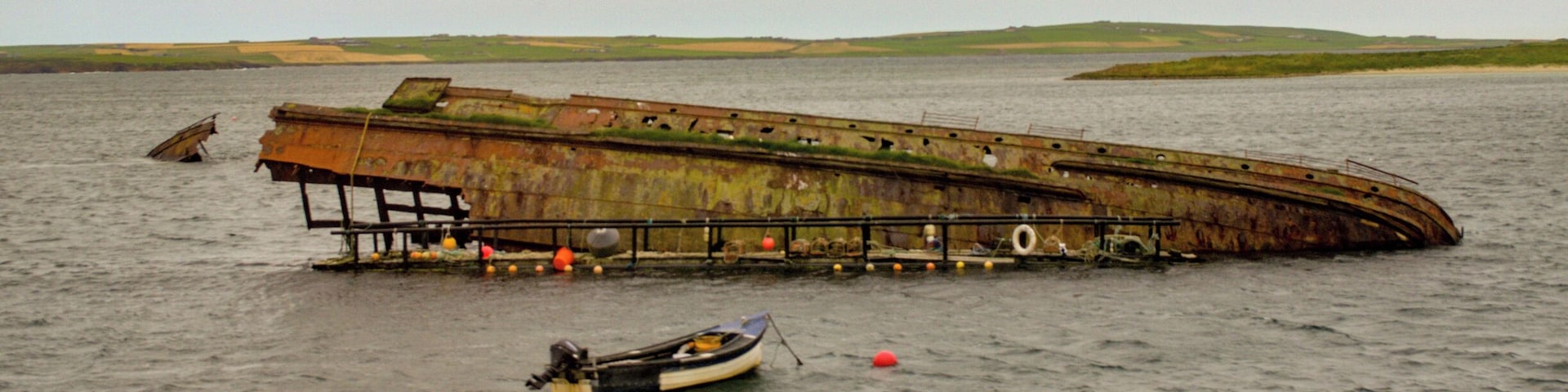The remains of the German High Seas Fleet that was scuttled in Scapa Flow. View taken from X1 Stagecoach bus crossing the Churchill Barriers from Burray to Mainland (right hand side). #History