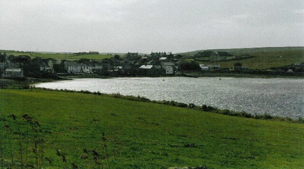St Margaret's Hope. The pretty bay and village, seen from the hillside by the A961, looking southwest.