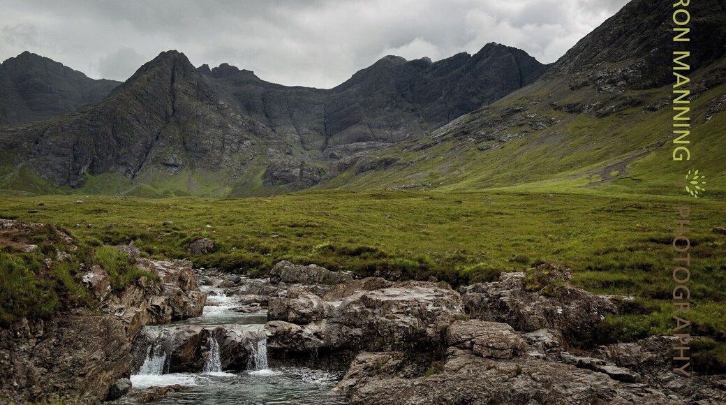 The Fairy Pools near Glenbrittle at the foot of the Black Cuillin Mountains on the Isle of Skye in the Highlands of Scotland. Very busy attraction but oh so beautiful to see.....walk along the path beside the falls and meandering river and enjoy this stunning location. Free admission is a bonus but watch the slippery rocks and steep climb back to the car, it's a bit of a killer! Perhaps partake in a coffee from Cuillin Coffee Van in the carpark when you're done.