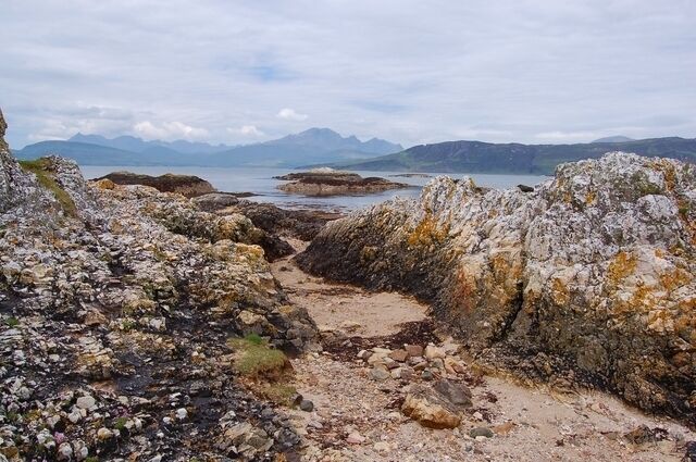Rocks on Ord beach Metamorphosised limestone outcrops on the sandy beach at Ord.