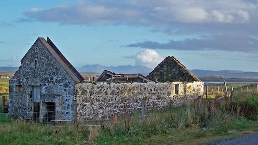 Derelict barn With the Cuillin mountains visible on the horizon.