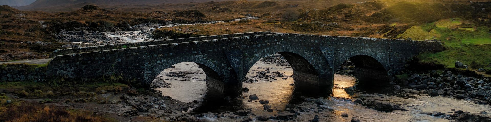 The Isle of Skye has always been seen as a magical place. Along with the beautiful landscape there are plenty of myths and legends to stimulate your imagination. With the landscape itâs easy to believe these stories. The Sligachan Bridge has a great tale, and whatâs more you can gain eternal beauty from the waters below the bridge.
This photo was photographed from the new bridge with a view of the Cuillins Mountains at the back.