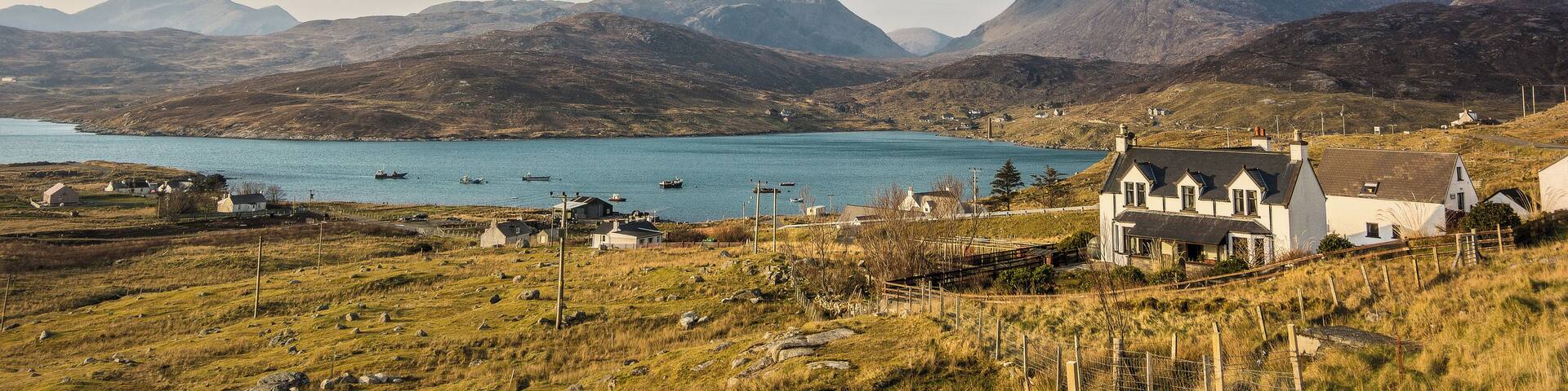 Ardhasaig with Clisham, the highest point on Harris & Lewis just to left of centre. Next to the shore just to the right of centre you can just make out the tall chimney stack of the old whaling station.