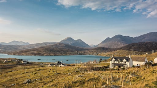 Ardhasaig with Clisham, the highest point on Harris & Lewis just to left of centre. Next to the shore just to the right of centre you can just make out the tall chimney stack of the old whaling station.