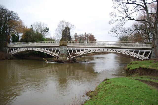 Perfection in cast iron By the mid 19th century the surveyors and iron masters working in the Welsh Marches had fine tuned the use of cast iron to produce magnificent bridges such as this one at Caerhowel. Their beautiful symmetry and fineness of structure had never been seen before, or since for that matter. This is one of the best that was made at The Brymbo Works. http://www.bhg.org.uk/BrymboHeritage/IndustrialHistory/Steelworks/Steelworks.htm The river in mid winter looks cold and menacing compared to the wonderful blues of summer.