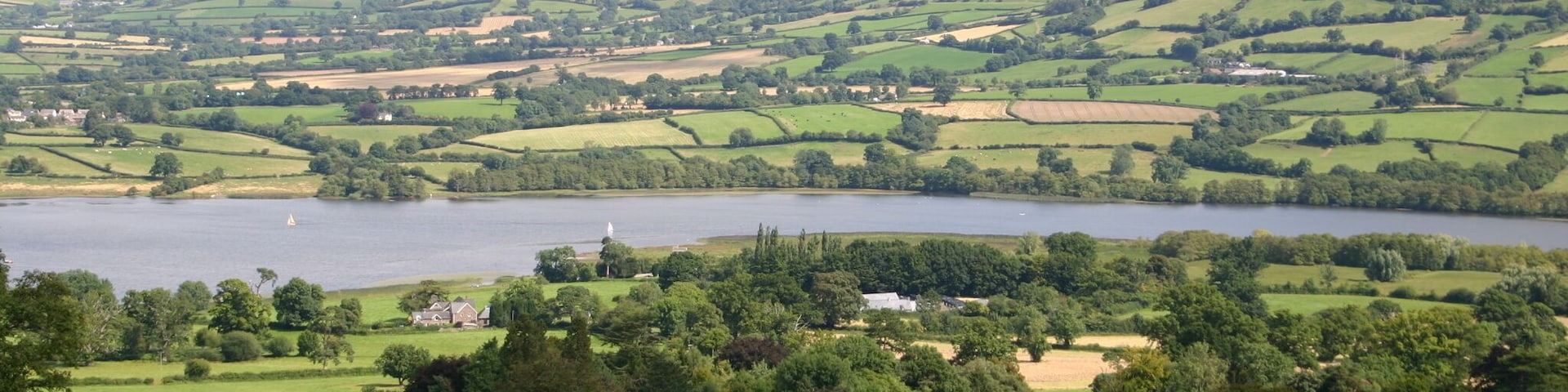 Allt yr Esgair From the footpath up Allt yr Esgair looking down to Treberfydd and in the distance out across Llangorse Lake to Mynydd Troed