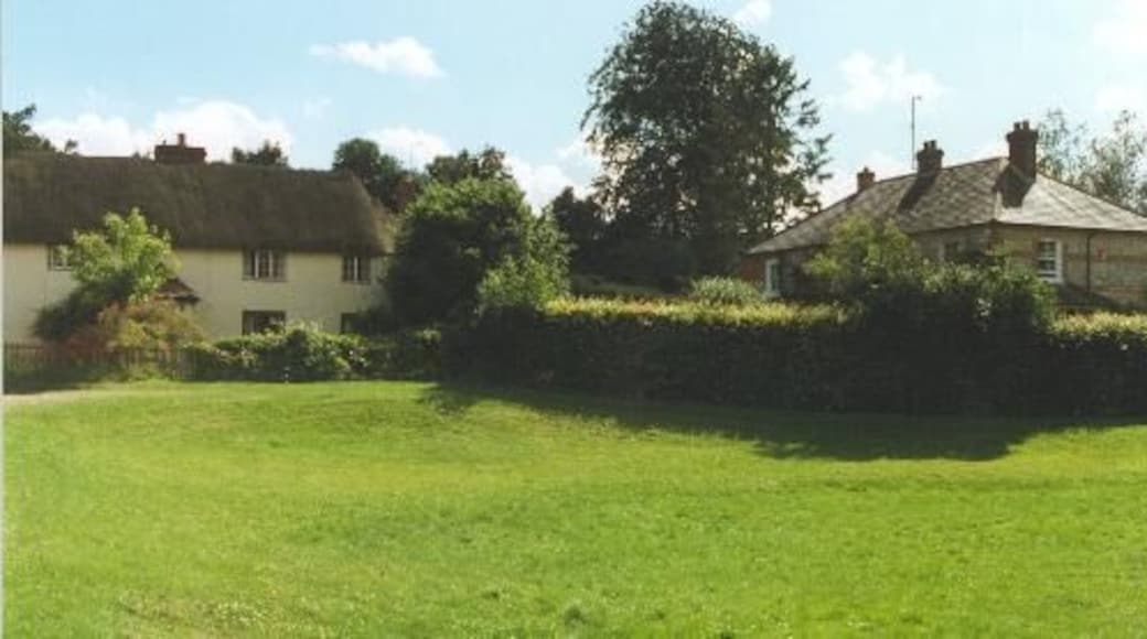 Old village pond, Vernham Dean. On the left is a thatched cottage built with chalk walls which was once a cheaper form of construction. On the right is a brick and flint cottage with a with a slate roof. Both forms of construction are typical for this part of Hampshire.