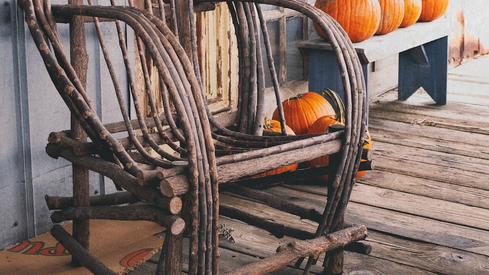Amish rocking chair on a porch with pumpkins in Nolensville, Tennessee