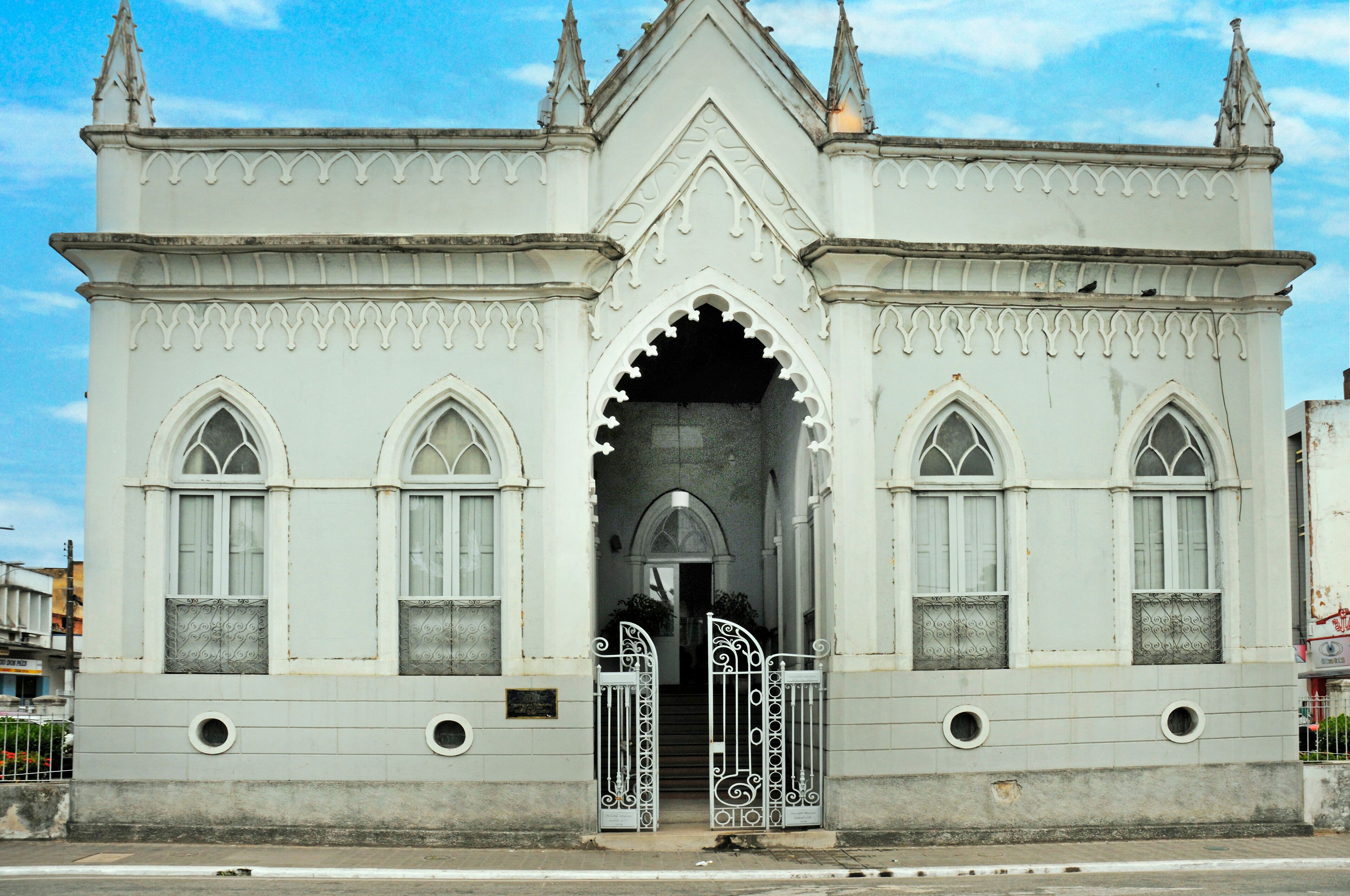 A white Gothic-style building with pointed arches and spires.