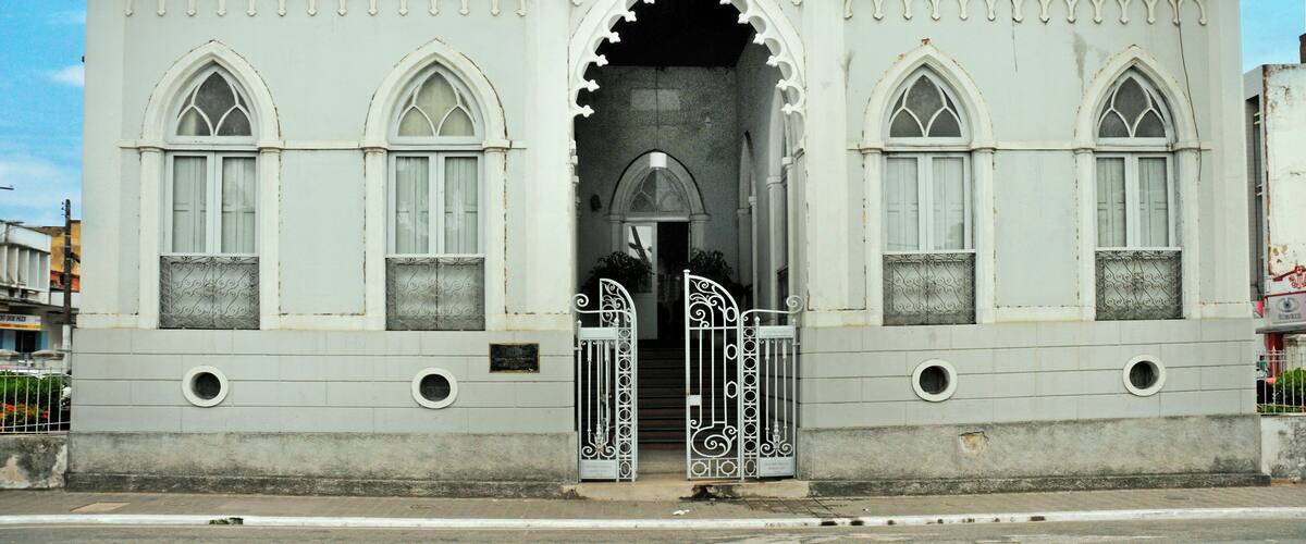 A white Gothic-style building with pointed arches and spires.