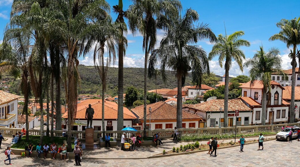 Panorama of traditional houses and palm tree lined street in historic center of Diamantina on a sunny day, Minas Gerais, Brazil