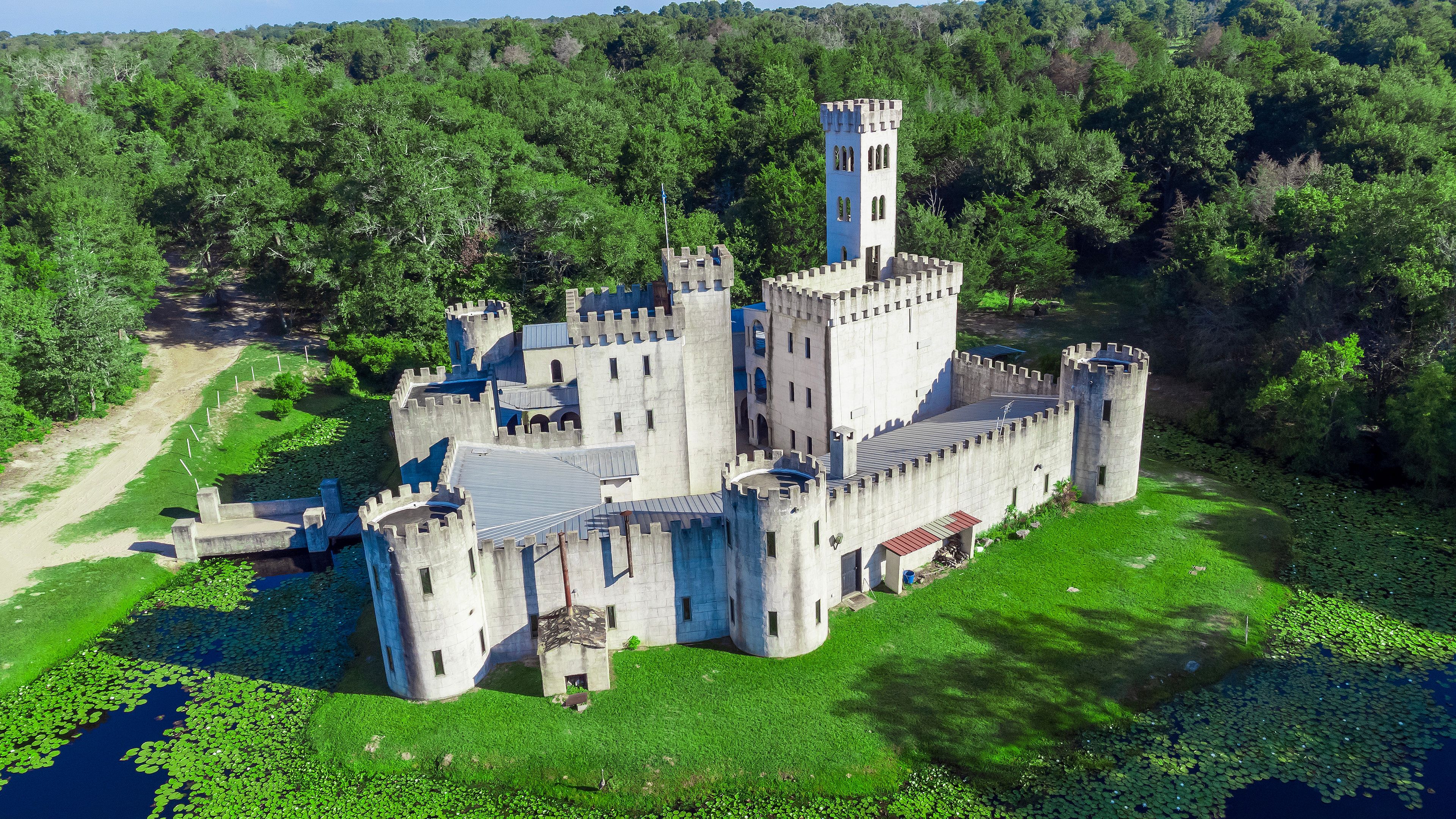 Drone view of Newman's Castle, a unique custom creation hidden just outside Bellville in the rolling countryside, TEXAS, USA.