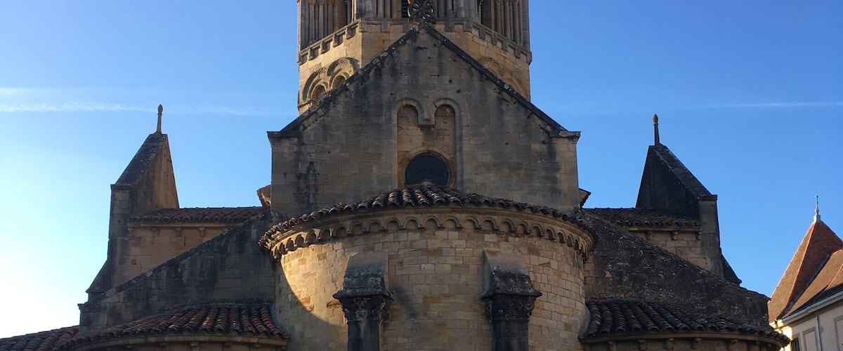 A historic church with a bell tower and arched windows.