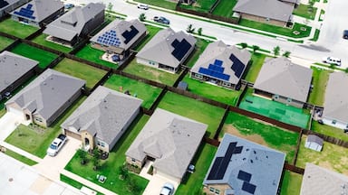 Panorama aerial view spacious backyard grassy lawn of new construction houses in fast growing Princeton, Collin County, Texas, clean energy efficiency home DFW metroplex, upscale residential area