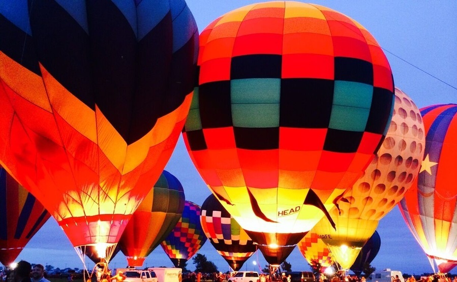 The Celina Balloon Festival The Old Celina Park at Celina , Texas from September 12-14'th 2014. Vibrantly patterned balloons glow and undulate as propane burners pump them with hot air. This festival also has a live band, carnival rides, food, fun and frolic. Pristine cars and trucks made as early as the 1930's shine at the classic car show. Entrance fee is $5 per person for a one day entry pass. Not to be missed!!!