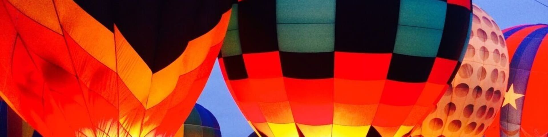 The Celina Balloon Festival The Old Celina Park  at Celina , Texas from September 12-14'th 2014.  Vibrantly patterned balloons glow and undulate as propane burners pump them with hot air.  This festival also has a live band, carnival rides, food, fun and frolic. Pristine cars and trucks made as early as the 1930's shine at the classic car show. Entrance fee is $5 per person for a one day entry pass. Not to be missed!!!