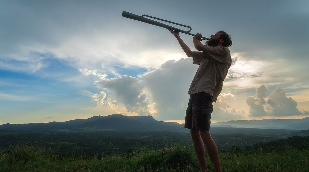 Blowing the Shepherd's horn. This horn was used to communicate over longs distances by shepherds.
I dined with shepherds for this experience: http://www.alwayswanderlust.com/dining-with-shepherds-in-the-carpathians/