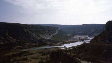 The old low bridge where US 90 crosses the Pecos River in Texas, about 1954. This bridge has since been replaced with a high-level bridge.