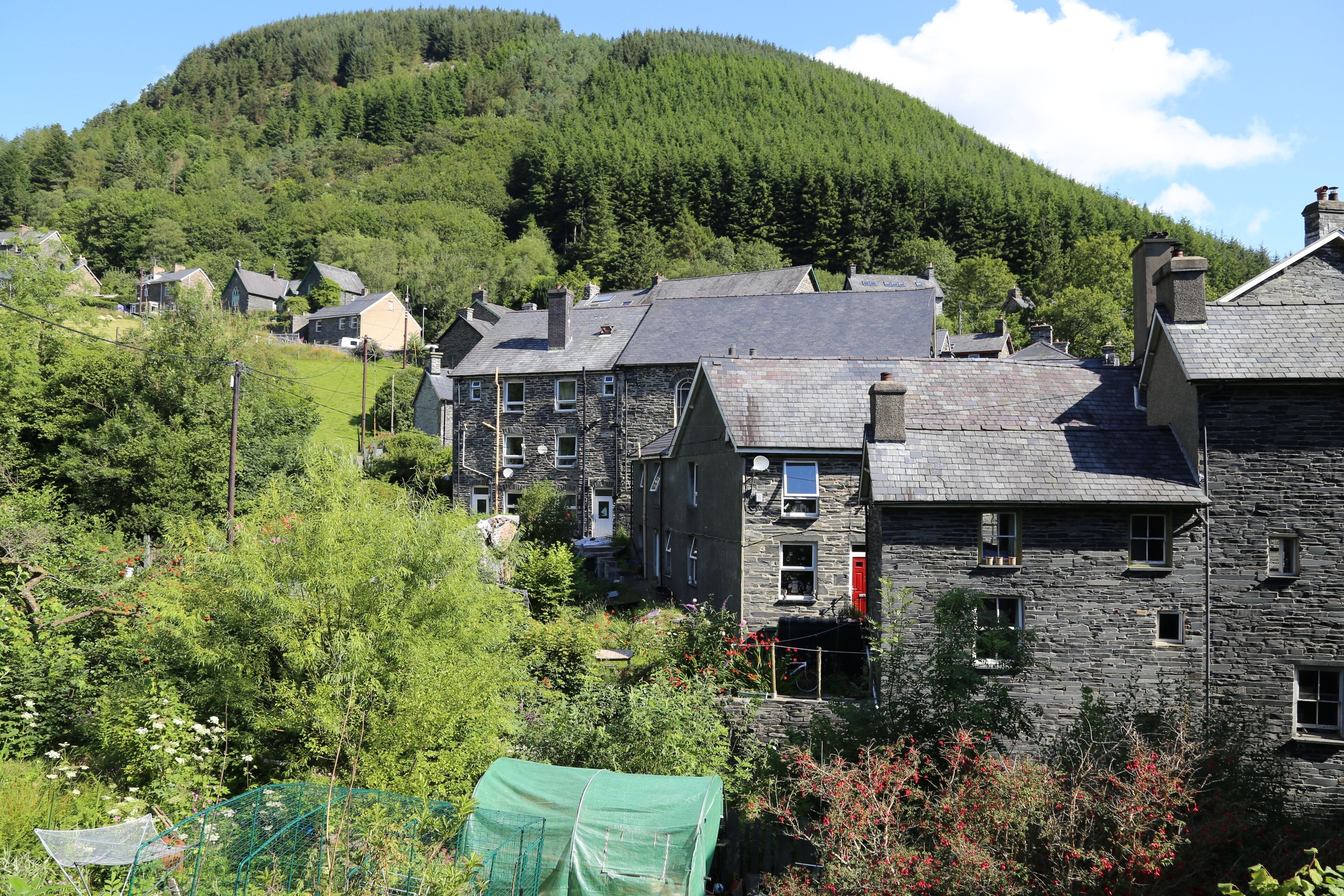 Slate cottages built on the side of a hill in the beautiful village of Corris, Wales, UK.