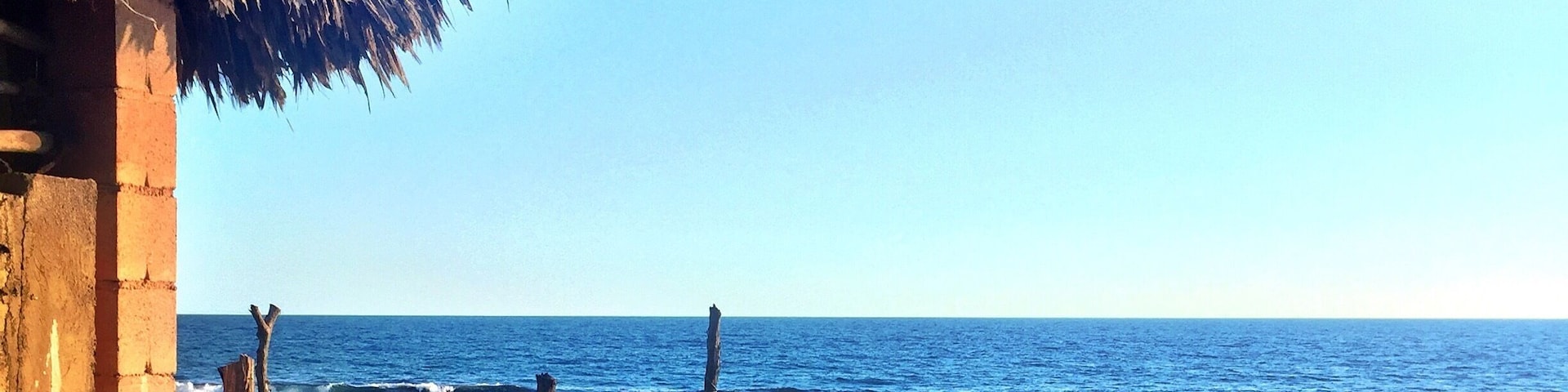 Palapa roofs & black sands