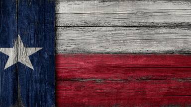Texas lone star painted on vintage rough wood background