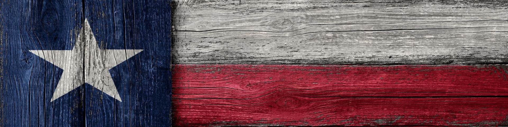 Texas lone star painted on vintage rough wood background