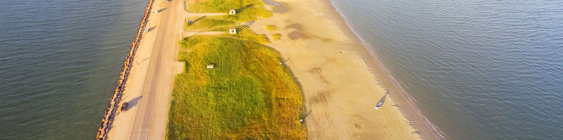 Panorama aerial view famous Texas City Dike, a levee that projects nearly 5miles south-east into mouth of Galveston Bay. It was designed to reduce the impact of sediment accumulation along lower Bay