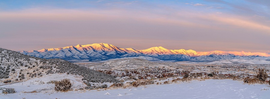View of Wasatch Mountains at Mount Timpanogos, Eagle Mountain in Utah with brilliant sunlight on top