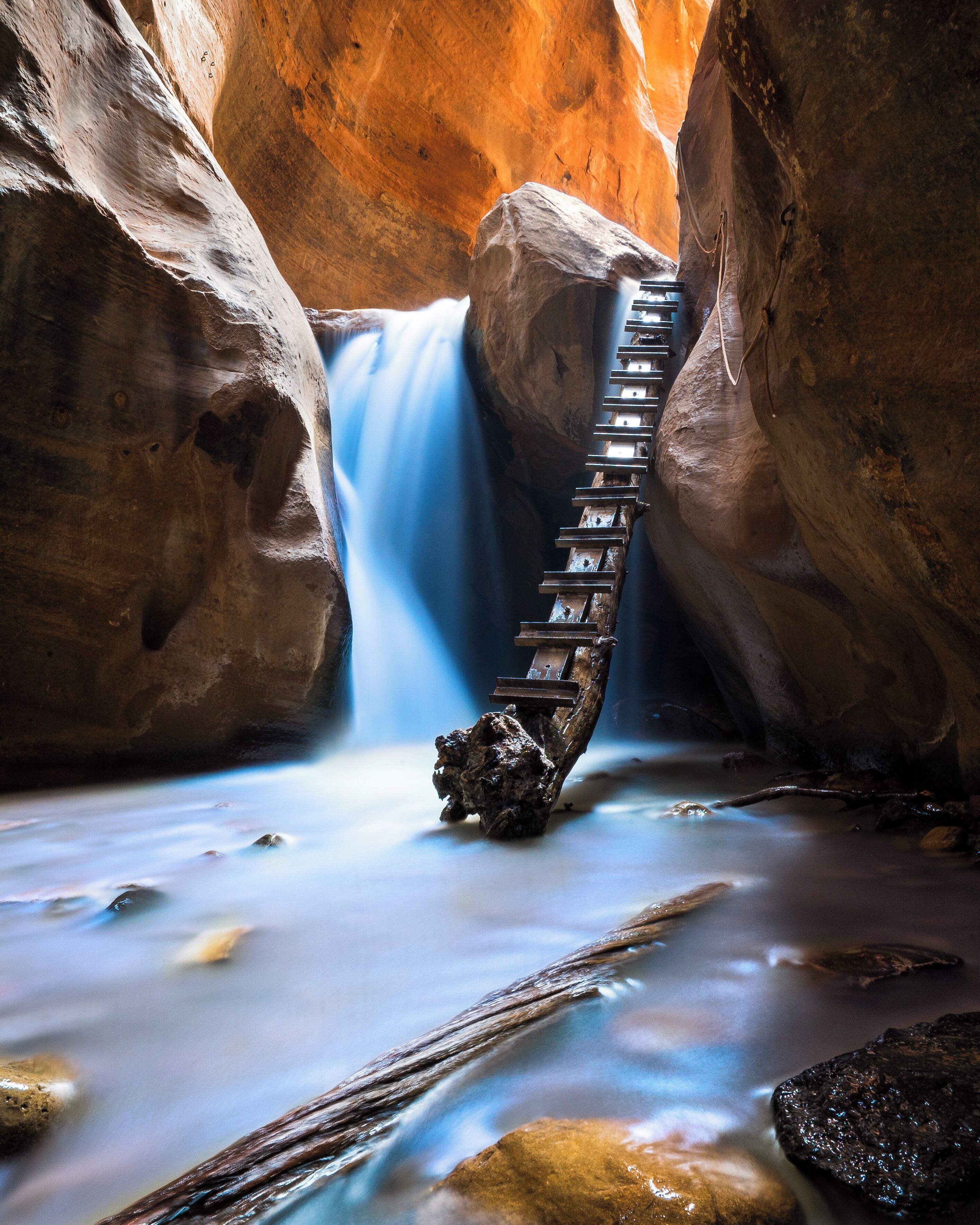 About one hour north of Zion National Park, Kanarraville offers a small slot canyon  accompanied by tree ladders & rope climbs leading to dramatic water cascades. #ADVENTURE