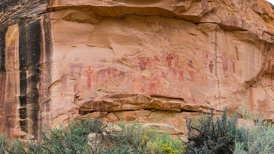 A large rock formation with ancient petroglyphs.