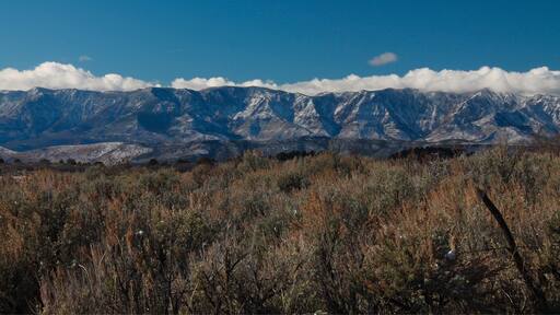 You'll see this view as you leave Zion National Park and travel toward the town of Virgin, UT. Spectacular scenery everywhere you look. #virginutah #mountains #blue #colorful