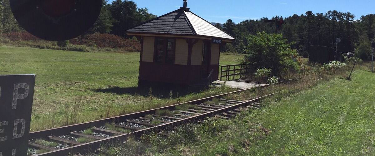 Found this property with a collection of railroad equipment, much of it crumbling, but not this small station house.