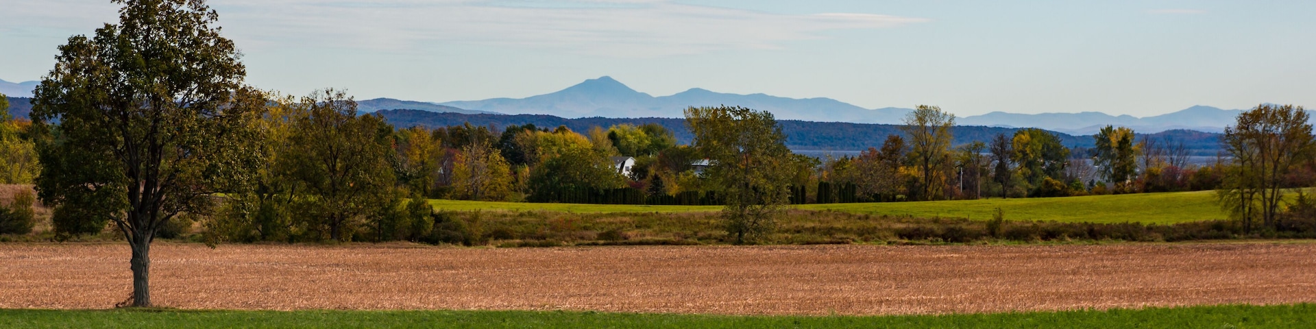 landscape of countryside on Grand Isle, one of the Lake Champlain Islands with Green Mountains of Vermont across the lake