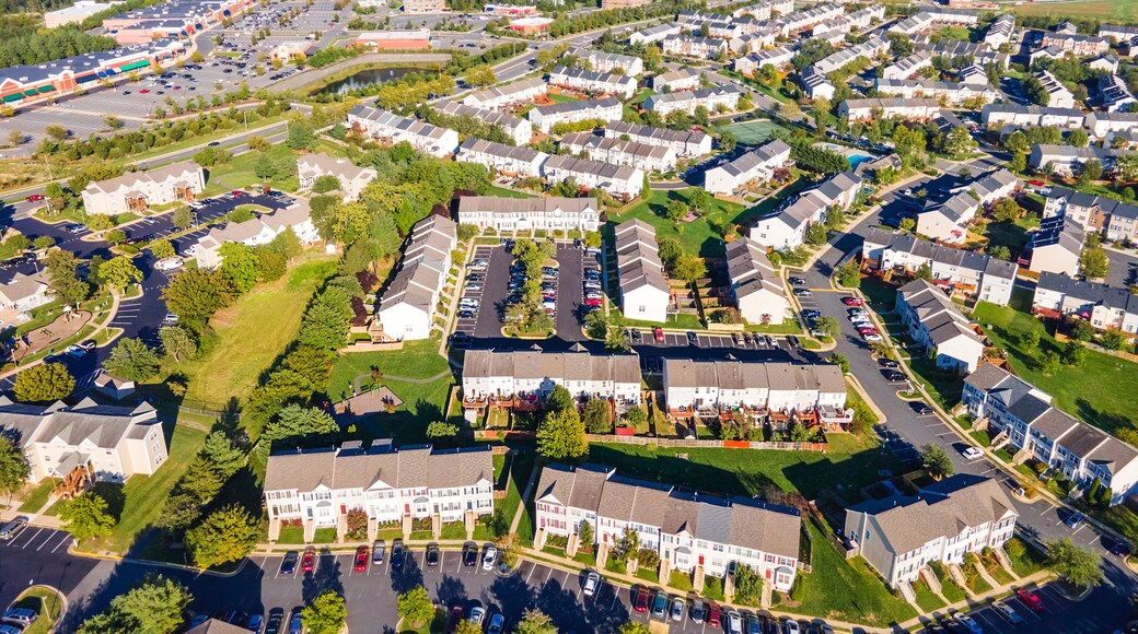 Aerial views of residential area, roads, parks and shopping areas.