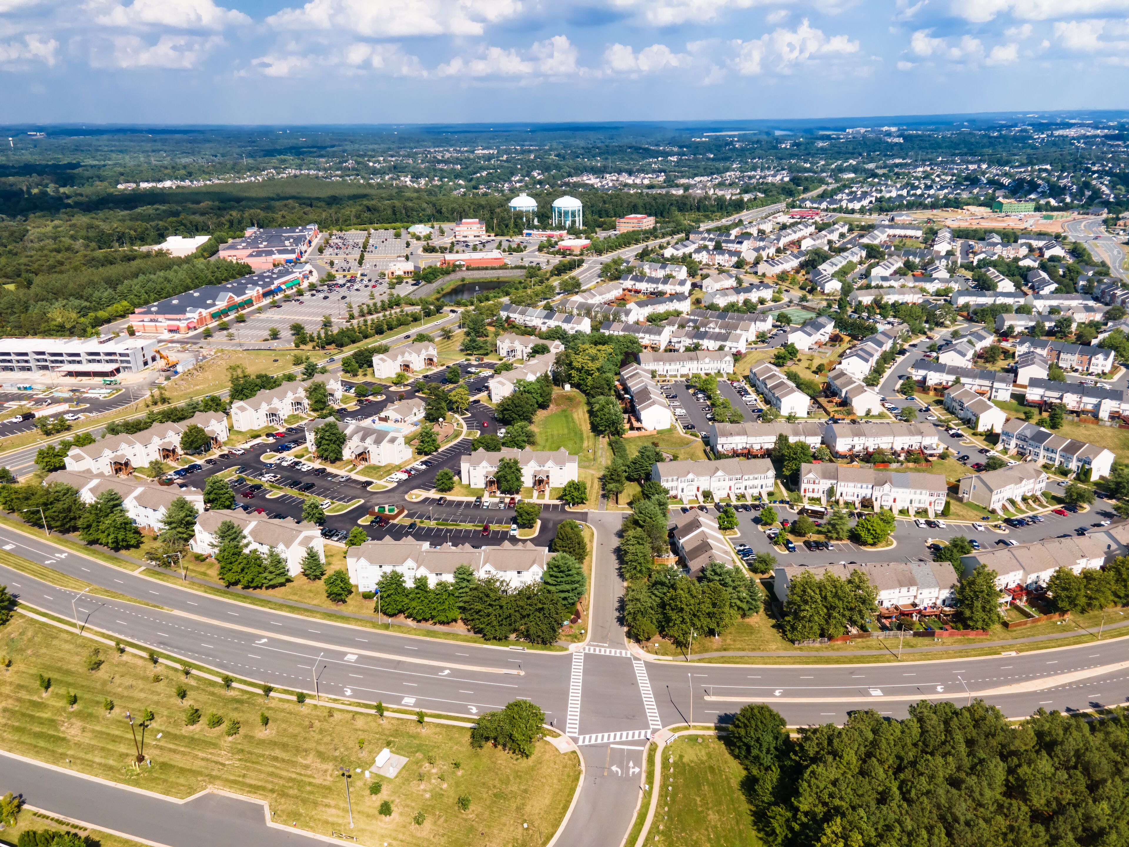 small winding streets, parking lots and roads in a residential area of a small town. Aerial view of