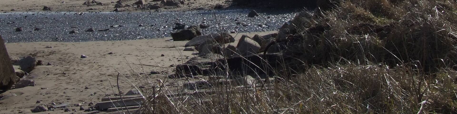 Fraisthorpe Beach, north east of Fraisthorpe, East Riding of Yorkshire, England. The blocks are concrete pillars which. were placed in the coast to keep the German tanks out of the UK during the Second Wold War.
